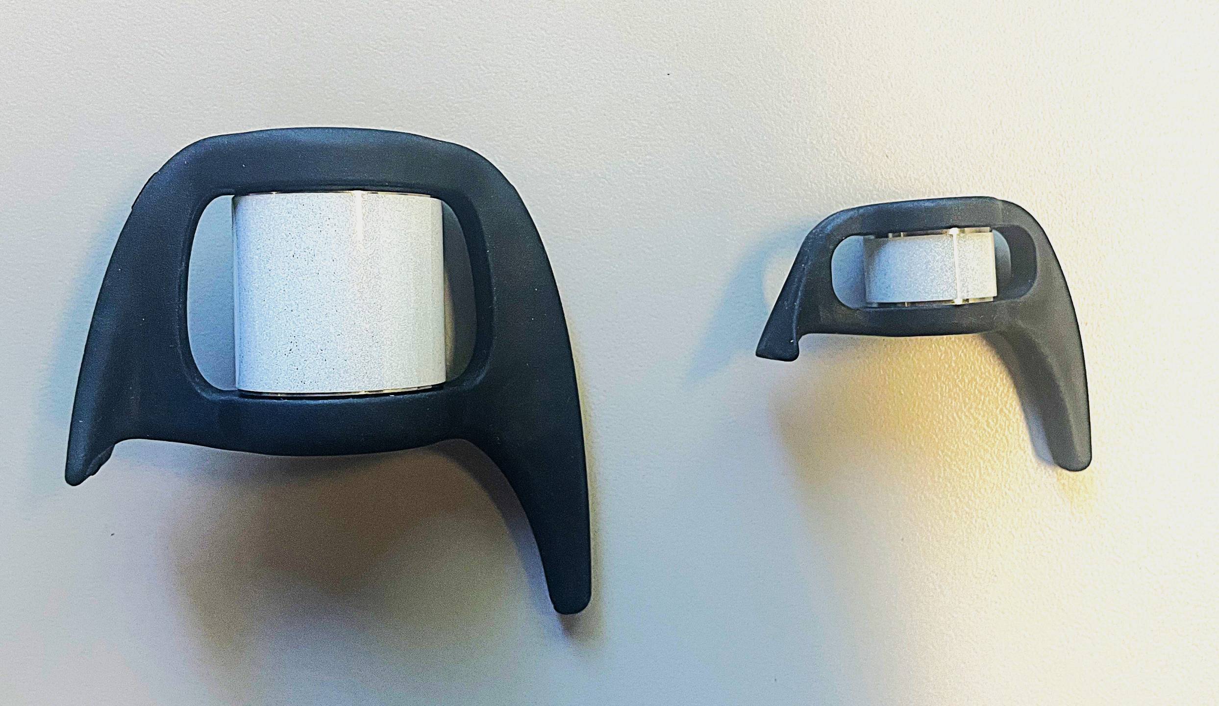 Large hollow end with large hook on one side, smaller version with smaller hook