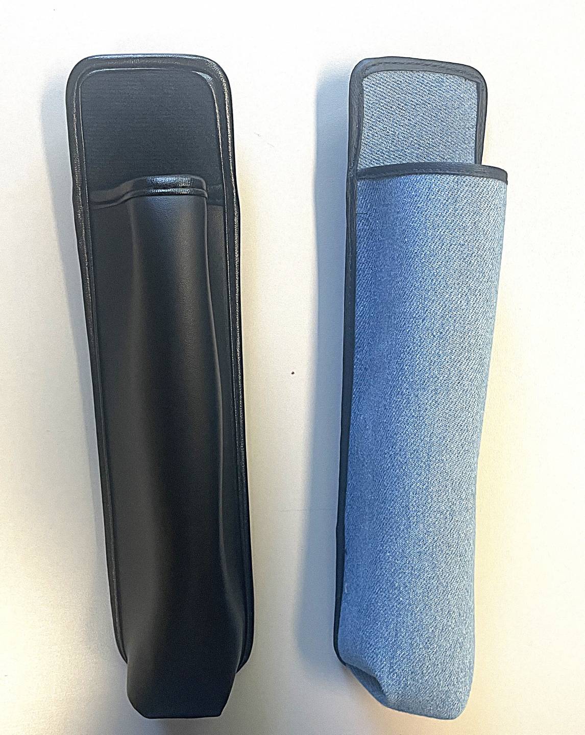 Black vertical pouch with belt clip on back, blue vertical pouch with black lining and belt clip on back