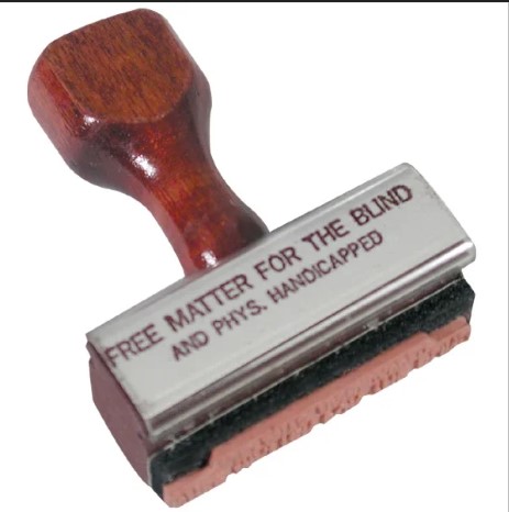 Rubber Stamp with wooden handle that says "Free Matter For the Blind and Phys. Handicapped"