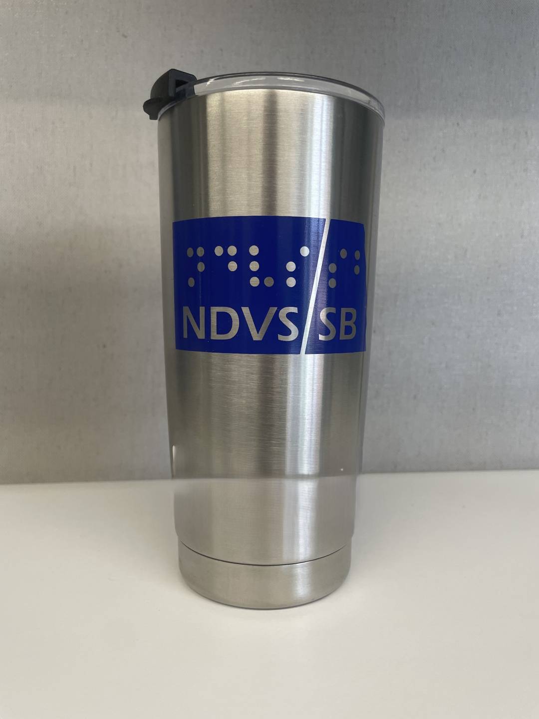 NDVS Tumbler, silver metal 20 oz tumbler with lid, and blue NDVS/SB Logo