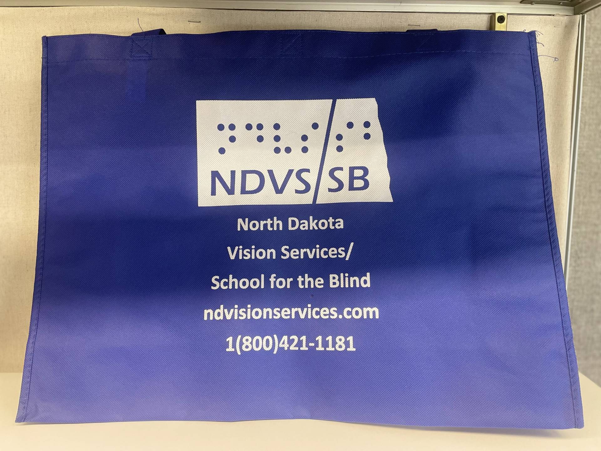 NDVS/SB Tote, large fabric tote with handles and white NDVS/SB Logo and information