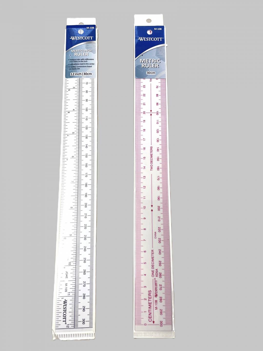 Metric Rulers, Clear flexible ruler with metric measurements on one side and standard measurements on the other in black print. Clear flexible ruler with metric measurements in red print.