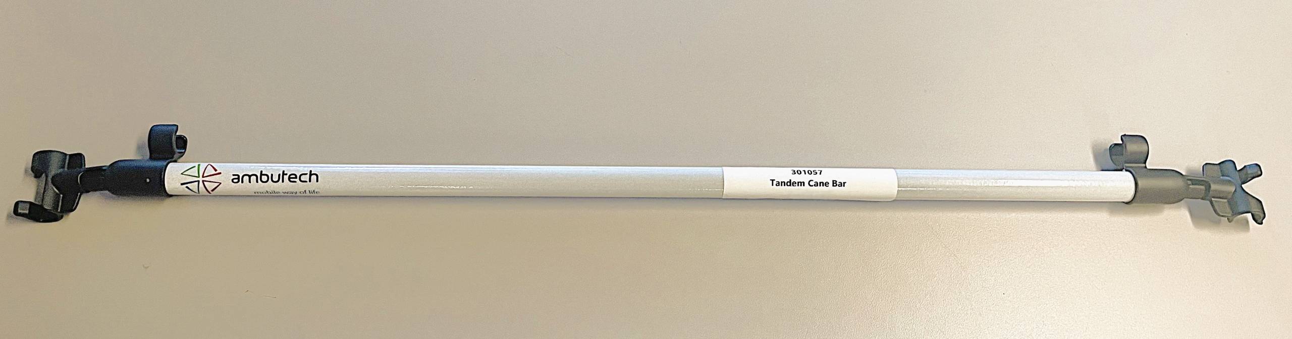 white bar with clips on each end to connect two canes together