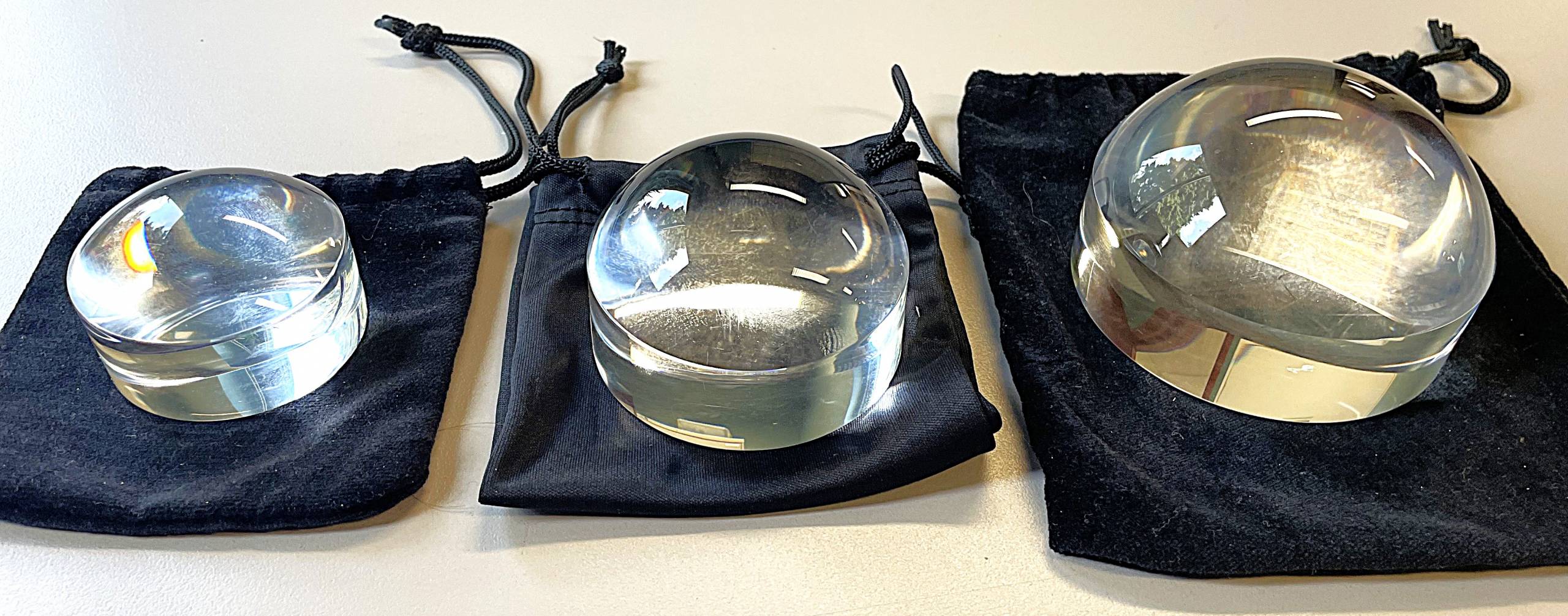 Small, medium, and large clear round magnifiers with rounded tops