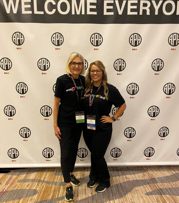 Lilly (right) stands next to colleague Lanna Slaby at the APH Annual Meeting in October 2022.