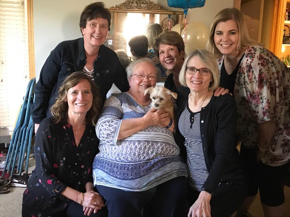 Mary poses smiling with 5 of her colleagues